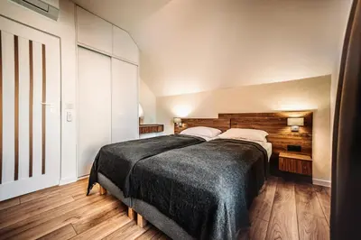 a bedroom with a large bed in a room at Jurajski Zakątek in Skała