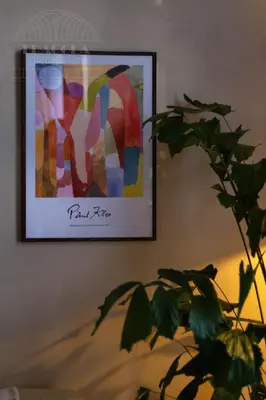 a picture hanging on a wall with a plant at Fragola Apartments Le Jardin - classy, spacious Old Town apartments in Kraków