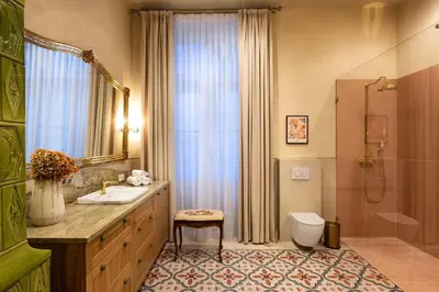 a bathroom with a sink and a toilet and a shower at Fragola Apartments Le Jardin - classy, spacious Old Town apartments in Kraków
