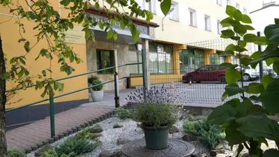 a garden in front of a building at Ośrodek SCSK Optima in Kraków