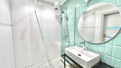 a bathroom with a sink and a mirror at MintKrak in Kraków