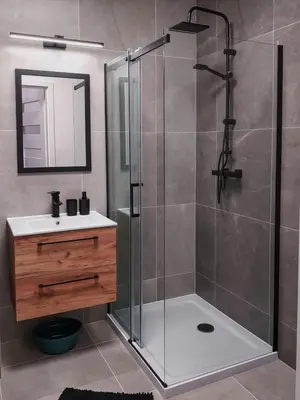 a bathroom with a shower and a sink at Apartament Bazylek, miejsce parkingowe w garażu podziemnym in Kraków