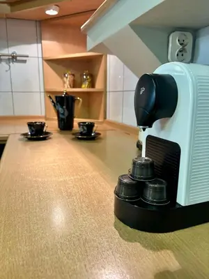 a coffee maker sitting on a counter in a kitchen at Vintage Senacka 3 Apartment in Kraków