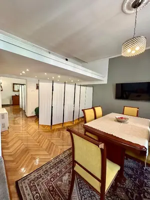 a dining room with a table and chairs at Vintage Senacka 3 Apartment in Kraków