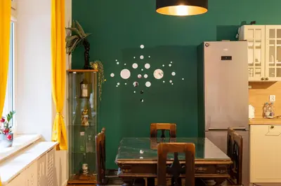 an old map of the world on a wall at Park Strzelecki Spacious Apartment by BookingHost in Kraków