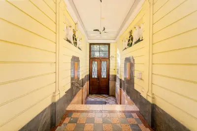a hallway of a house with a wooden door at Park Strzelecki Spacious Apartment by BookingHost in Kraków