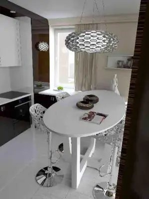 a white table and chairs in a kitchen at Family Modern apartment 35m2-for Max 5 persons in Kraków