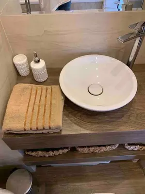 a bathroom sink with a white plate and a sink at Family Modern apartment 35m2-for Max 5 persons in Kraków