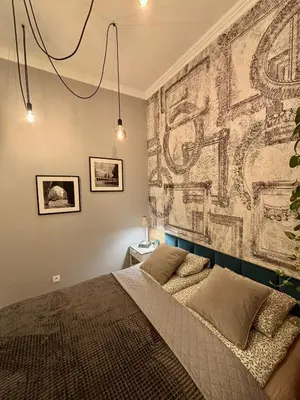 a bedroom with a bed and a wall mural at The Vinci Residence, Kraków Old Town in Kraków