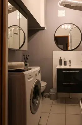 a large flat screen tv in a living room at Sunny Apartment near Krakus Mound in Kraków
