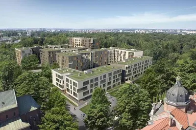 a view of a courtyard with buildings at night at Rakowicka Apartment - free parking in Kraków