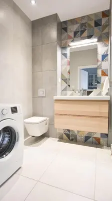 a bathroom with a washing machine and a sink at Rakowicka Apartment - free parking in Kraków