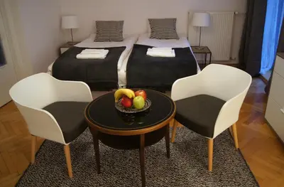 a bedroom with a bed with two towels on it at Apartament Daszyńskiego in Kraków