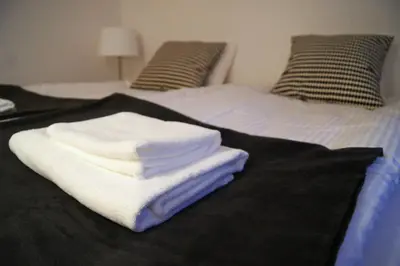 a bathroom with a sink and a towel at Apartament Daszyńskiego in Kraków