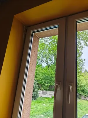 an open window with a view of a yard at Bramka do lasu in Dąbrowa Górnicza