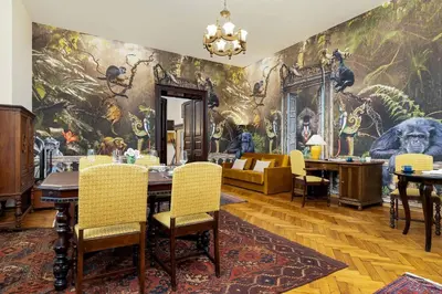 a dining room with a large painting on the wall at Efektowny i Przestronny Apartament w Centrum Krakowa Blisko Rynku i Parku by Noclegi Renters in Kraków
