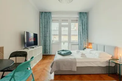 a bathroom with a shower and a toilet and a sink at Roomy apartments Łobzowska Street in Kraków
