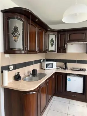a kitchen with a sink and a microwave at Maldives for three in Jaworzno