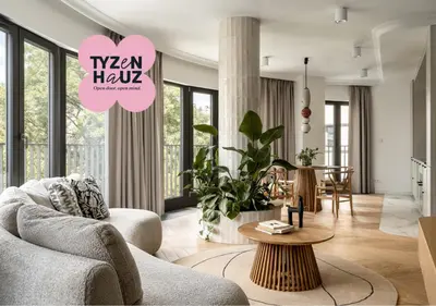 a living room with a couch and a table at Smoleńsk by Tyzenhauz in Kraków