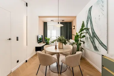 a living room with a tv on a wall at Smoleńsk by Tyzenhauz in Kraków