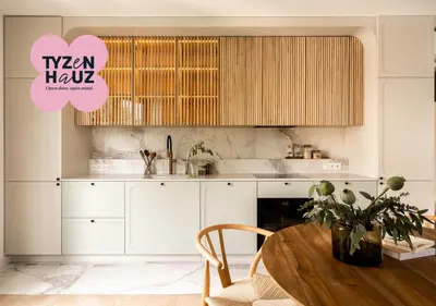 a living room with a white couch and a table at Smoleńsk by Tyzenhauz in Kraków