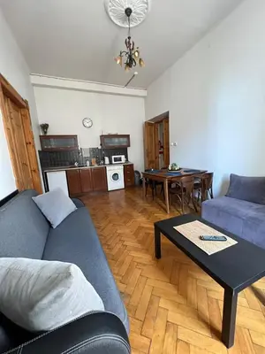 a living room with a couch and a table at Old Town Apartments in Kraków