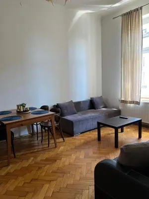 a living room with a couch and a table at Old Town Apartments in Kraków