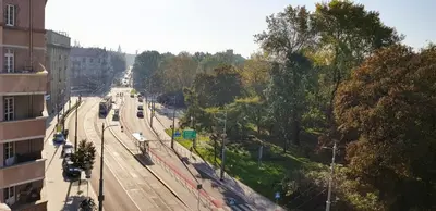 an overhead view of a city street with train tracks at Freedom Hostel in Kraków