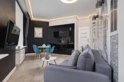 a living room with a couch and a table at Marylin Studio - Czysta 5 Street in Kraków