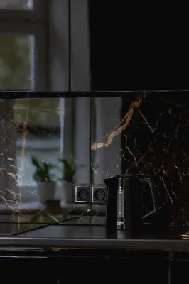 a coffee pot sitting on a counter in front of a microwave at Marylin Studio - Czysta 5 Street in Kraków