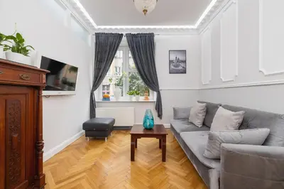 a living room with a couch and a table at 2 bedroom apartment - Sereno Fenn'a 5 street in Kraków