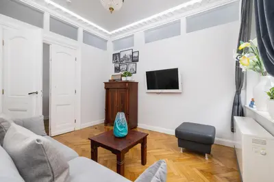 a living room with a couch and a tv at 2 bedroom apartment - Sereno Fenn'a 5 street in Kraków