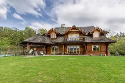 a large log house with a large yard at Holzvilla Nähe Krakau in Krzywaczka