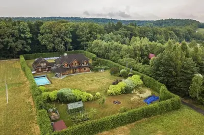 an aerial view of a large estate with a house at Holzvilla Nähe Krakau in Krzywaczka