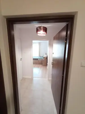a hallway with a door leading to a bedroom at Old Town Premium Apartment in Kraków