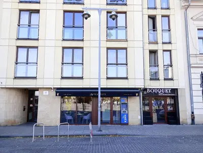 a large building with a street light in front of it at Old Town Premium Apartment in Kraków