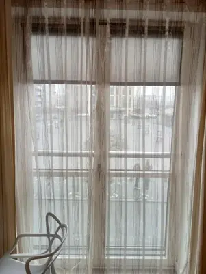 a window with a chair in front of it at Old Town Premium Apartment in Kraków