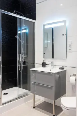 a bathroom with a shower and a sink and a toilet at Apartment with Air Conditioning in the heart of Cracow heart in Kraków