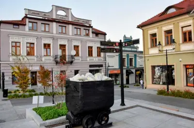 a trash can in the middle of a city street at Salt Mine Apartment Bochnia by OTH in Bochnia