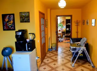 a living room with yellow walls and a room at Salt Mine Apartment Bochnia by OTH in Bochnia