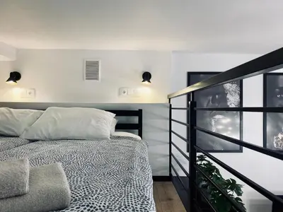 a bedroom with a bed and a balcony at Apartment Premium Jacuzzi for couples, Old Town in Kraków
