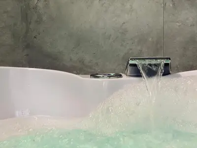 a bath tub with water coming out of it at Apartment Premium Jacuzzi for couples, Old Town in Kraków