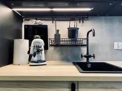 a kitchen counter with a mixer and a sink at Apartment Premium Jacuzzi for couples, Old Town in Kraków