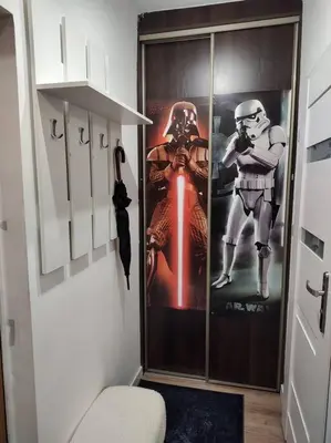 a room with a door with a movie poster on it at Star Wars Climate Apartment in Kraków