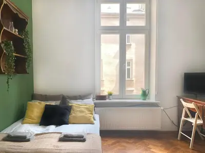 a bedroom with a bed and a window at Large 89m2 Apartment, 3 bedrooms and 2 bathrooms in Kraków