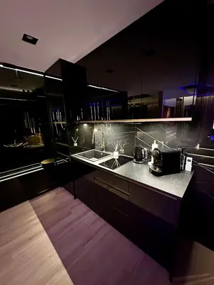 a kitchen with a sink and a counter top at Masarska 6 VIP Apartamenty JACUZZI in Kraków