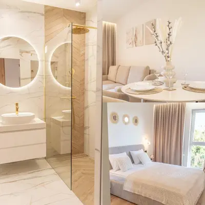 a bathroom with a shower and a bed and a sink at K&M Apartments Near Tauron Arena in Kraków