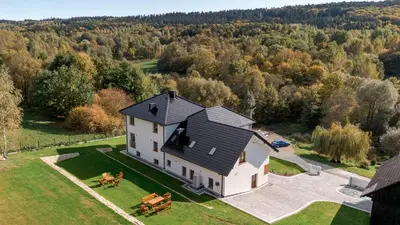 an aerial view of a house with two horses in the yard at Zacisze pod Chełmem in Stryszów