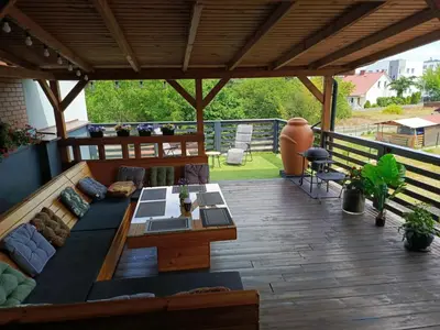 a living room with a couch and a table at Apartament U ELI z prywatnym tarasem in Oświęcim