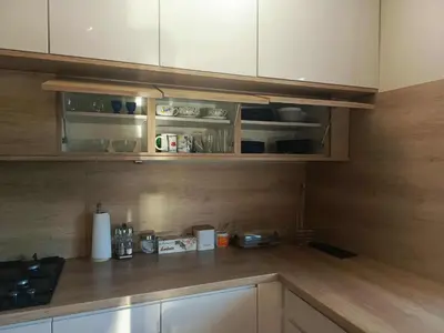 a group of pots and pans on a rack in a kitchen at Apartament U ELI z prywatnym tarasem in Oświęcim